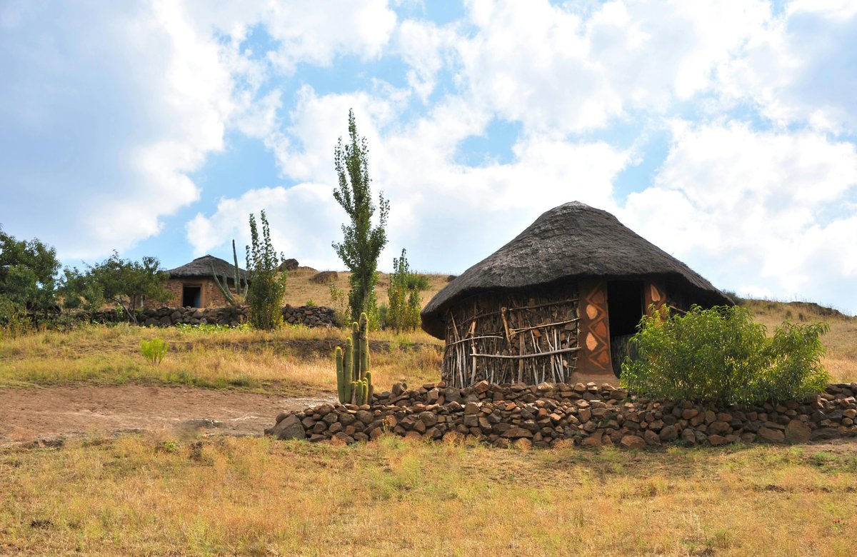 Traditional huts and local village scene